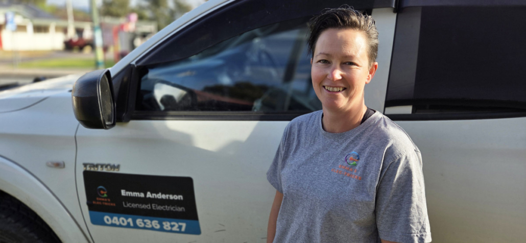 Woman standing next to a truck.