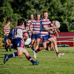 Six footy players running