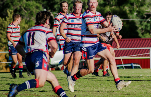 Six footy players running