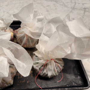 Close up of wrapped food parcels.