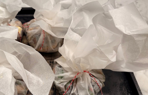 Close up of wrapped food parcels.