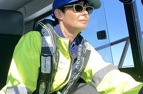 Caron Parfitt in uniform in the Marine Rescue vessel in