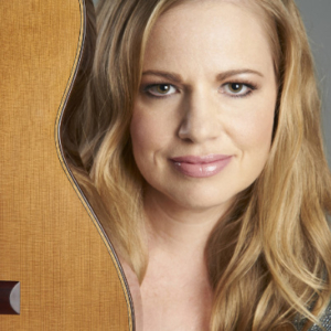 Woman holding a guitar