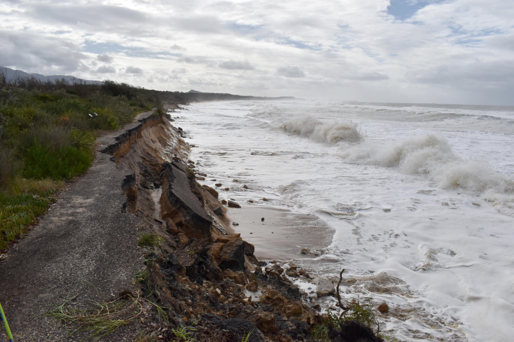 Track beside the ocean that has fallen away due to storm damage