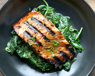 A piece of salmon in a non-stick pan