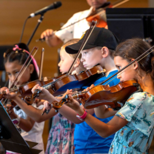 Four young people playing violins