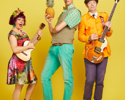 Three performers in colour costumes