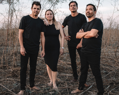 Four musicians dressed in black.