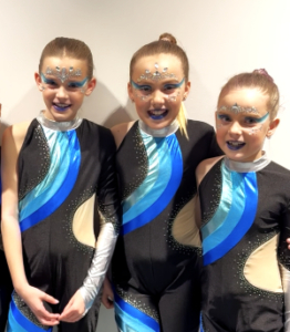 Three girls in their dance costumes
