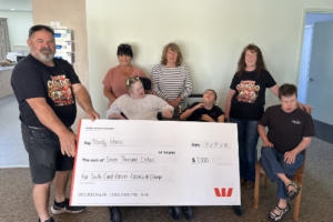 Group of people with a giant checque