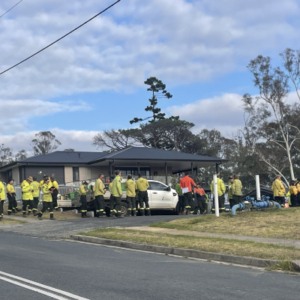 Group of rural firefighters and their vehicles