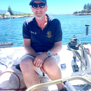 Man sitting on the deck of a yacht