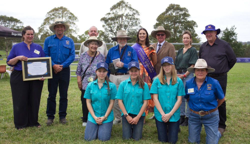 Group of people receiving their prizes.
