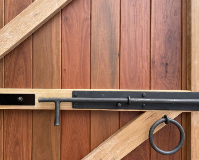 Latch of a hand-crafted wooden door.