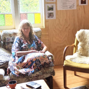 Woman sitting in a chair.