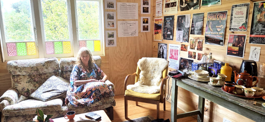 Woman sitting in a cozy living room.