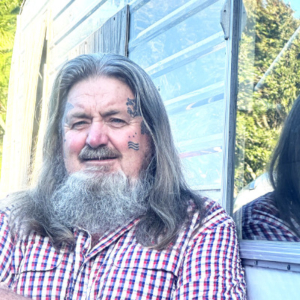 Man in front of a caravan