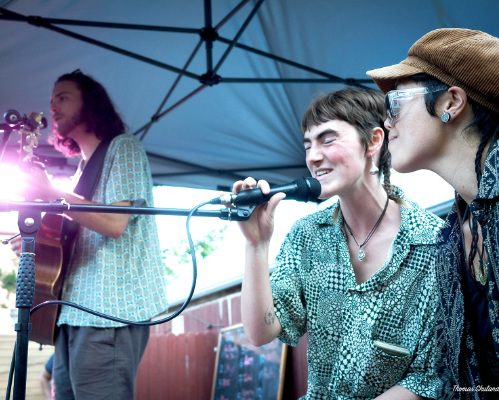 Three musicians performing.