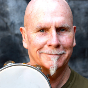 Man's head with a tambourine