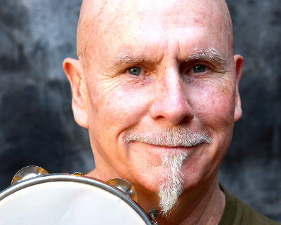 Man's head with a tambourine