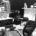 B&W photo of the inside of a radio studio with the mixing deck in the foreground.