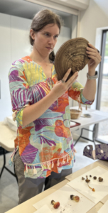 Woman looking at a very large fungus.