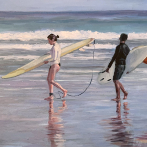 Two people on a beach with surf boards