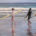 Two people on a beach with surf boards