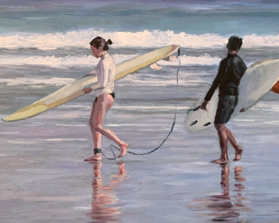 Two people on a beach with surf boards