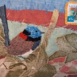 Artwork of wren and stamp in fabric materials