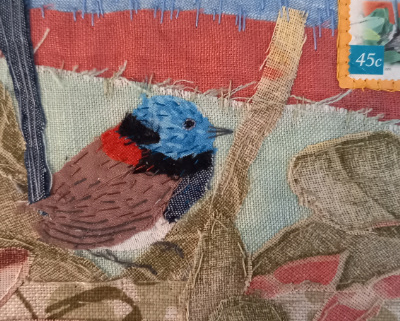 Artwork of wren and stamp in fabric materials