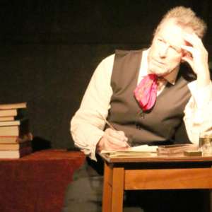 Man leaning on elbow at a table