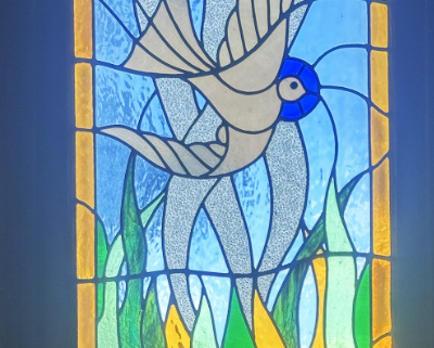 Stained glass depiction of a bird