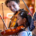 Two people playing violins