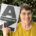 Woman holding a book with very large letters AZ on the cover.