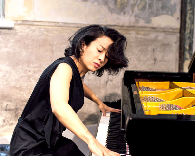 Woman playing the piano.
