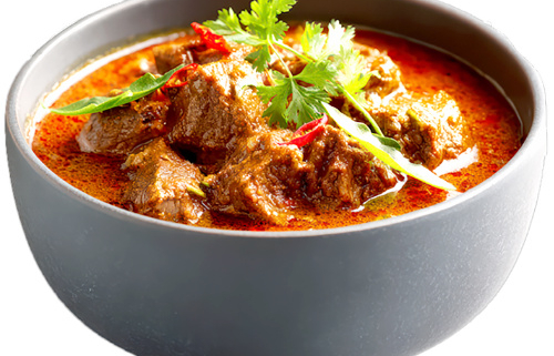 Bowl of tomato based curry in a bowl