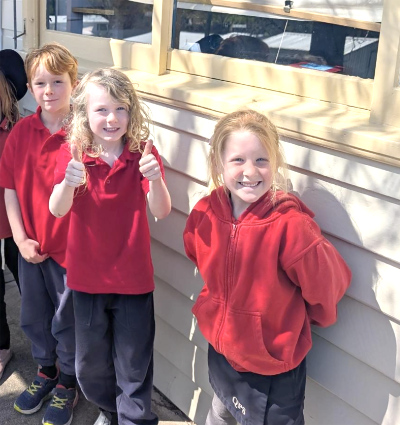 Three smiling children